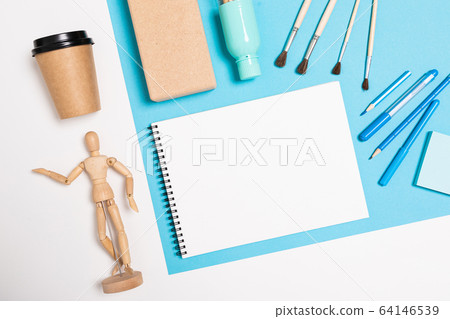 flat view of the office desk with a creative arrangement of stationery and notebooks for the desktop flat view of the office desk with a creative arrangement of stationery and notebooks for the desktop 64146539