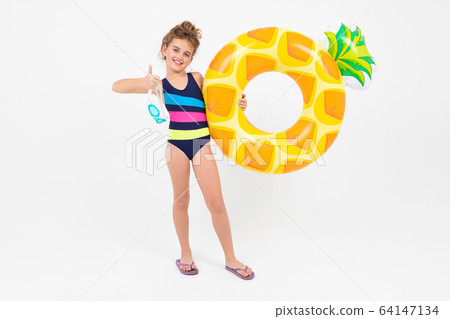 happy girl child on summer vacation by the sea with swimming circles isolated on white background happy girl child on summer vacation by the sea with swimming circles isolated on white background 64147134