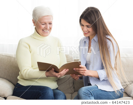 Financial consultant presenting bank investments to senior woman 64147423