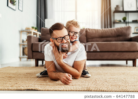 Father and little son having fun at home Father and little son having fun at home 64147788