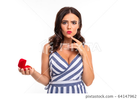 Portrait of nice caucasian girl holds a little box with a ring isolated on white background Portrait of nice caucasian girl holds a little box with a ring isolated on white background 64147962