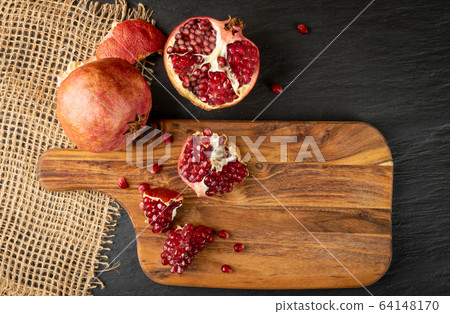 Fresh Ripe Organic Pomegranate Fruit with Juicy Fresh Ripe Organic Pomegranate Fruit with Juicy 64148170