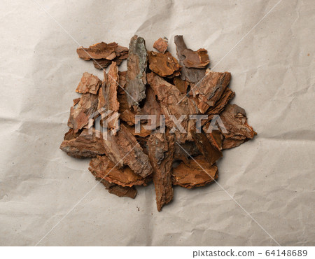 Heap of Pine Tree Bark Chip on Old Paper Heap of Pine Tree Bark Chip on Old Paper 64148689