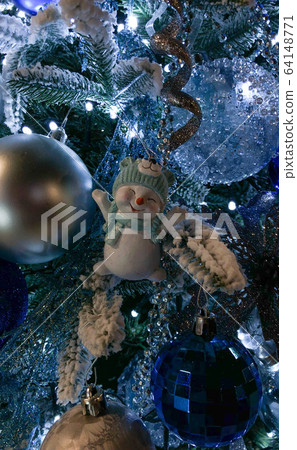 Close up of beautifully decorated Christmas ornament decorations in a Christmas tree Close up of beautifully decorated Christmas ornament decorations in a Christmas tree 64148771