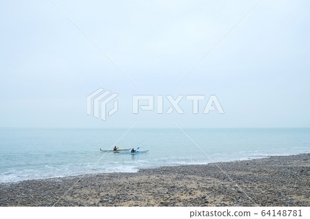 Two people Kayaking in the sea Two people Kayaking in the sea 64148781
