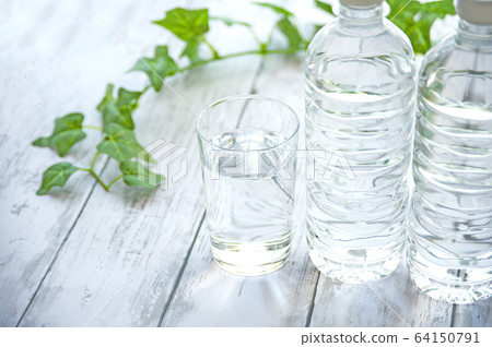 PET bottles and cups with water 64150791