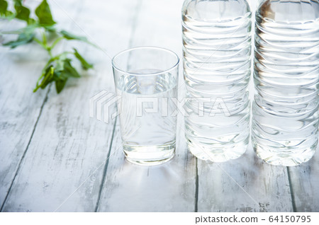 PET bottles and cups with water 64150795