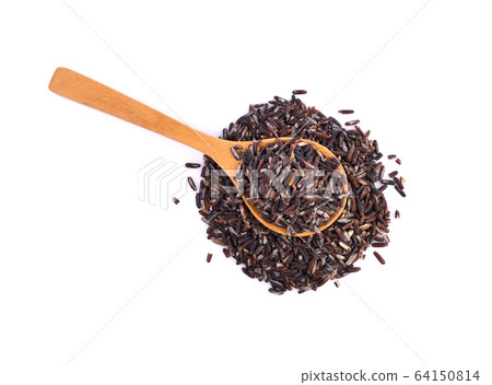 brown rice on wooden spoon on white background. brown rice on wooden spoon on white background. 64150814