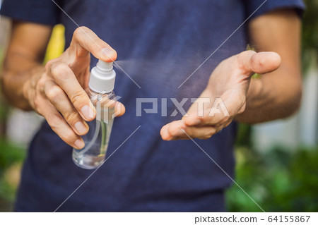 Men's hands using wash hand sanitizer gel Men's hands using wash hand sanitizer gel 64155867