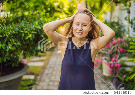 I love my skin. A young woman with freckles, moles, scars and facial wrinkles loves her skin, enjoys I love my skin. A young woman with freckles, moles, scars and facial wrinkles loves her skin, enjoys 64156013