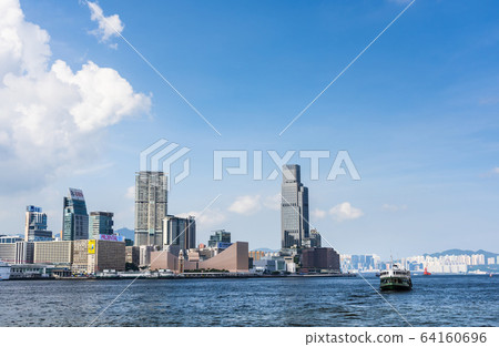 City skyline view of Tsim Sha Tsui across Victoria Harbour with city lights of Hong Kong Cultural Center, Clock Tower and Star Ferry piers City skyline view of Tsim Sha Tsui across Victoria Harbour with city lights of Hong Kong Cultural Center, Clock Tower and Star Ferry piers 64160696