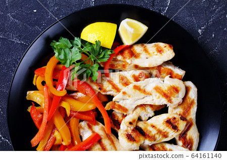 Restaurant style grilled chicken with sweet pepper Restaurant style grilled chicken with sweet pepper 64161140