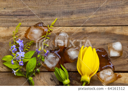 background texture purple flower ,yellow flower ylang ylang and iced water arrangement flat lay postcard style background texture purple flower ,yellow flower ylang ylang and iced water arrangement flat lay postcard style 64161512
