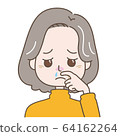 Middle-aged woman with a runny nose 64162264
