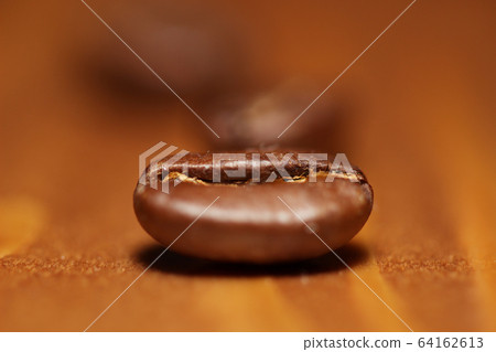 Macro shot of roasted coffee beans 64162613