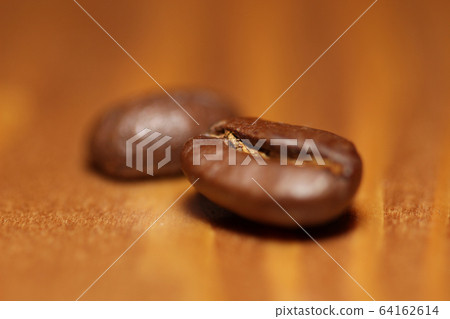 Macro shot of roasted coffee beans 64162614