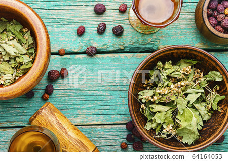 Dried crataegus in herbal medicine. Dried crataegus in herbal medicine. 64164053