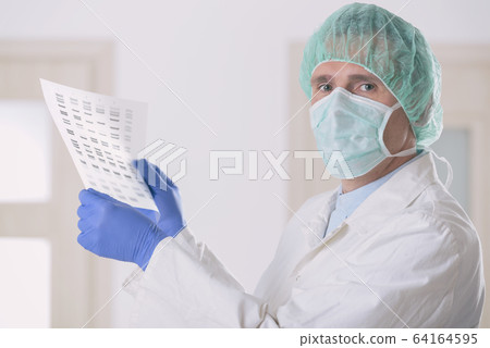 Scientist analizing DNA sequence 64164595