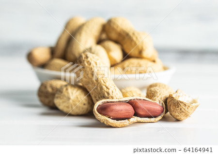 Tasty unpeeled peanuts. Tasty unpeeled peanuts. 64164941