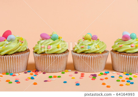 Easter pistachio cupcakes with decorations 64164993