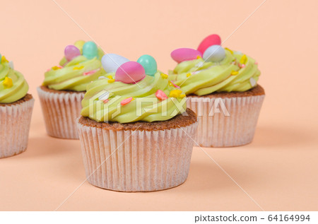 Easter pistachio cupcakes with decorations 64164994