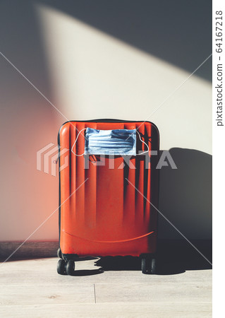 Personal red luggage with protective mask 64167218