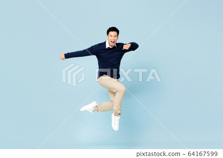 Young handsome Asian man smiling and jumping 64167599