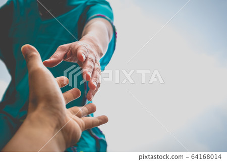 Help Concept hands reaching out to help each other. 64168014