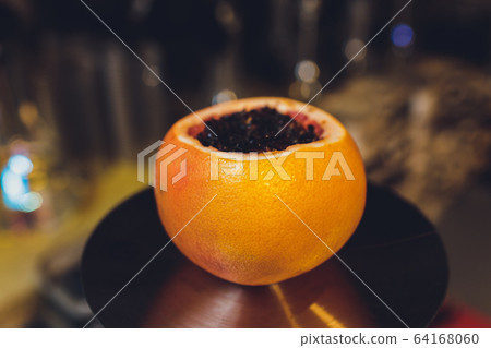 Hookah on orange with mint and citrus fruit. 64168060