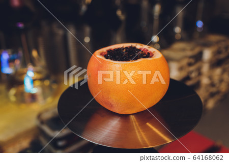 Hookah on orange with mint and citrus fruit. 64168062