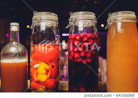 Bottles of tincture or potion and dry healthy herbs, bunch of healing herbs. Herbal medicine. Retro styled. Bottles of tincture or potion and dry healthy herbs, bunch of healing herbs. Herbal medicine. Retro styled. 64168066