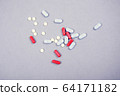Colored medicine pills 64171182