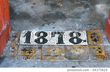 Inscription 1878 on floor by the entrance to Inscription 1878 on floor by the entrance to 64173624