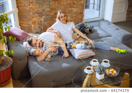 Mother, father and son at home having fun, comfort and cozy concept 64174179