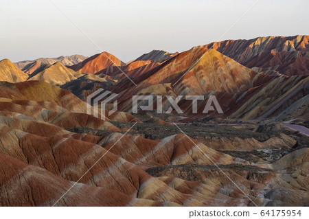 Colorful Zhangye Danxia National Geopark or China's Rainbow Mountains during sunset golden hour, Gansu, China Colorful Zhangye Danxia National Geopark or China's Rainbow Mountains during sunset golden hour, Gansu, China 64175954