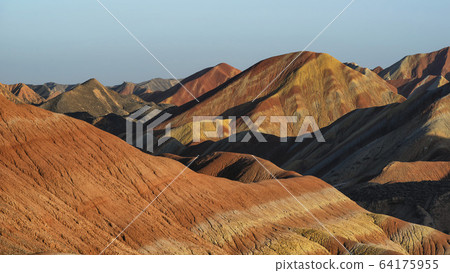 Colorful Zhangye Danxia National Geopark or China's Rainbow Mountains during sunset golden hour, Gansu, China Colorful Zhangye Danxia National Geopark or China's Rainbow Mountains during sunset golden hour, Gansu, China 64175955