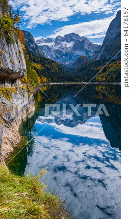 Autumn Alps mountain lake with clear transparent Autumn Alps mountain lake with clear transparent 64178157