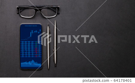 Office workplace table with smartphone, glasses Office workplace table with smartphone, glasses 64178401