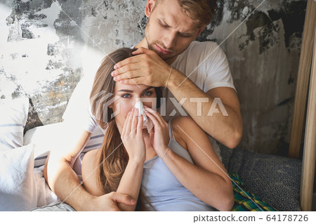 Pretty longhaired girl looking straight at camera Pretty longhaired girl looking straight at camera 64178726