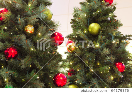 decorated trees for christmas and new year, pine lights and bauble 64179576