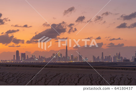 Dubai Downtown skyline with desert sand, United 64180437