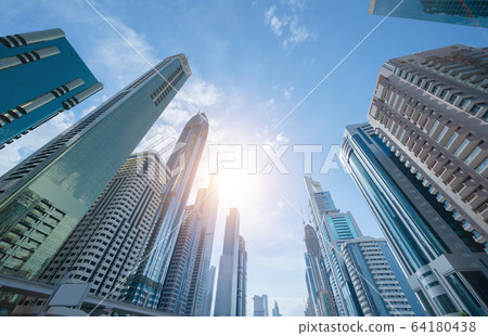 Looking up to high-rise office buildings, 64180438