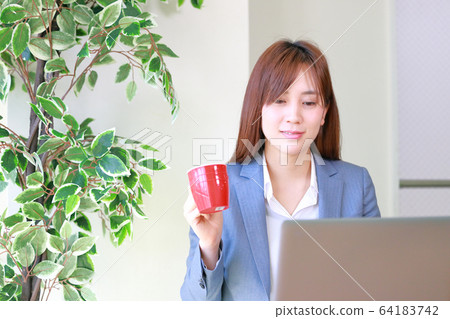 Business woman with expression of completed work 64183742
