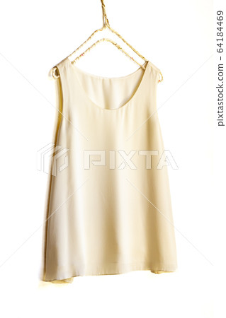 White beige tank top on a hanger White beige tank top on a hanger 64184469