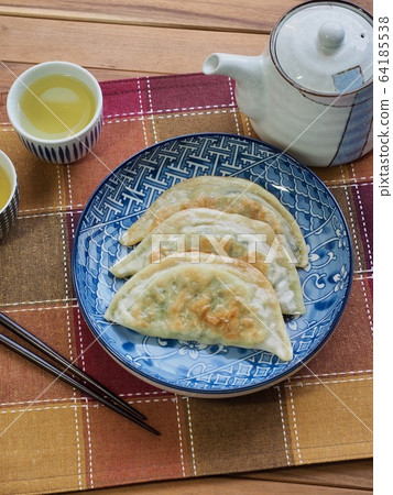 Asian food Gyoza dumplings and green tea, Dim Sum Asian food Gyoza dumplings and green tea, Dim Sum 64185538