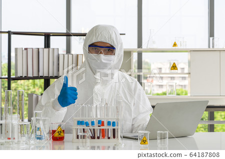 Asian scientist posing confidently in the laboratory. 64187808