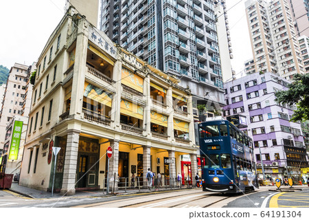 Busy Wan Chai street with Wo Cheong Pawnshop in Hong Kong. It is one of the busy business zones in Hong Kong 64191304