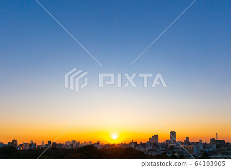 Sunset and cityscape over clear sky Sunset and cityscape over clear sky 64193905