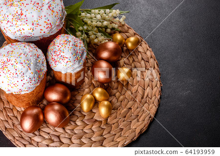 Easter eggs gold and bronze and Easter cake Easter eggs gold and bronze and Easter cake 64193959