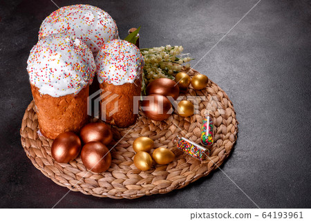 Easter eggs gold and bronze and Easter cake 64193961
